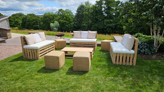 An example of Attentive Event's rustic outdoor furniture range. Comprising of pallet benches, coffee tables and hessian wrapped cubed pouffes.