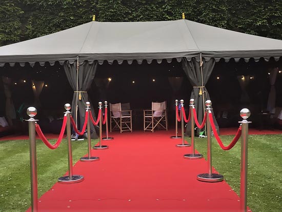 A Hollywood Themed 9x6m Boutique Tent Lined with Starcloth Linings, Red Carpet, Chrome Posts with Red Ropes, Creating an effect of Awe and Wonder.