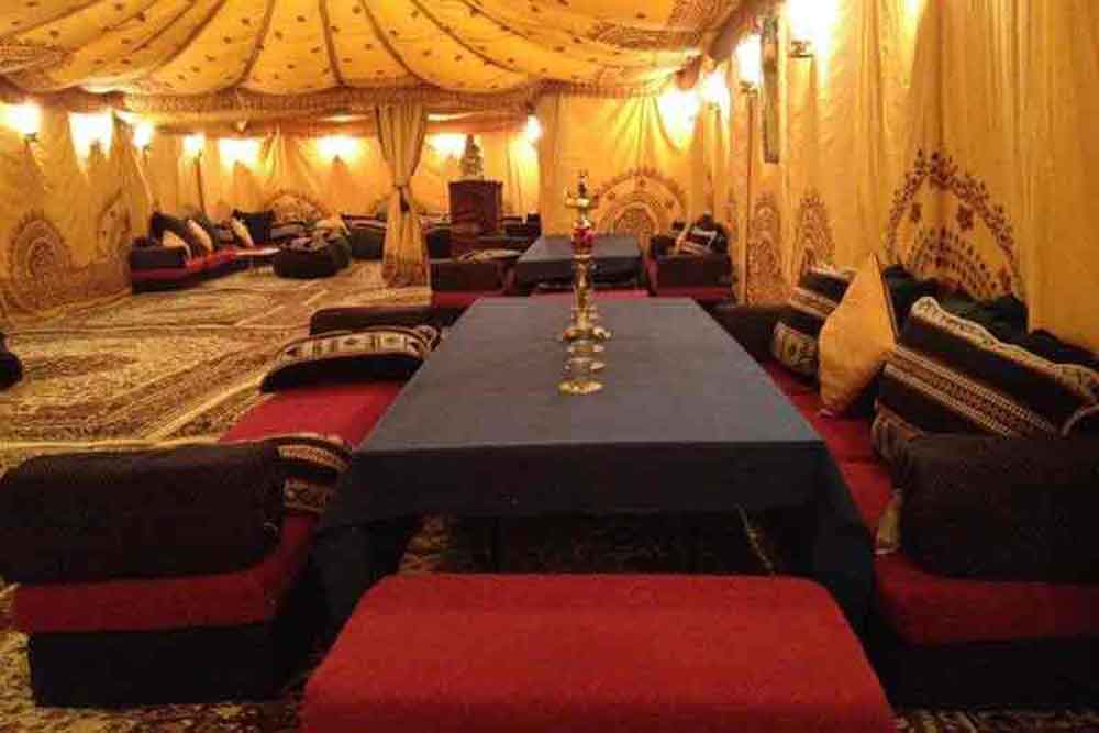 Low-Level Dining Table with Arabian Cushions - Fun and Stylish Event Setup