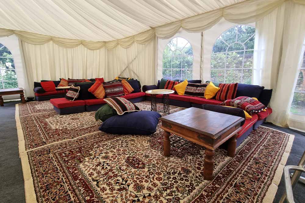 Arabian low-level chillout seating with polished brass coffee tables