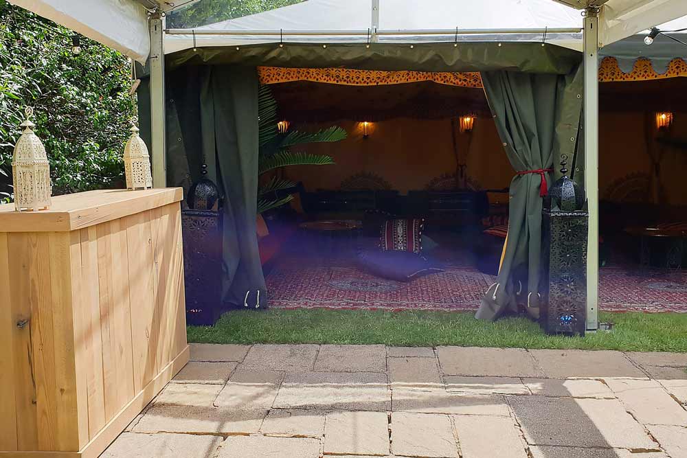 A reclaimed pallet champagne bar unit serving bubbles on your special day.