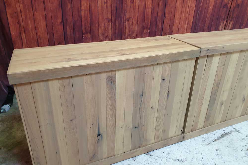 Two Reclaimed Wood Pallet Bars Placed Side by Side.