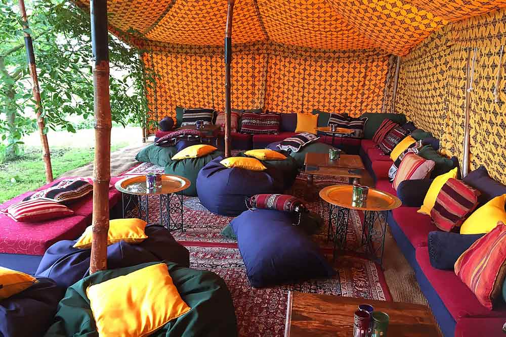 Colourful low-level chillout seating cushions providing a cozy furniture option