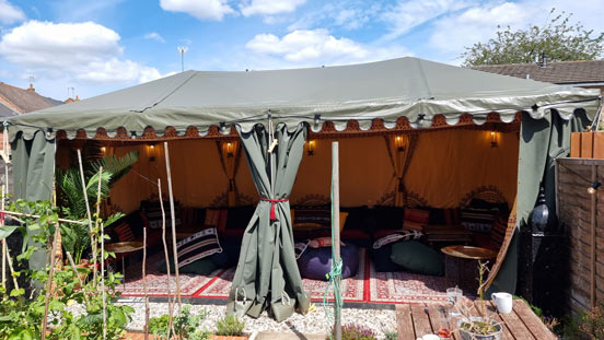 A small 3x6m Arabian marquee set up in a tight garden in Wimbledon, South London.