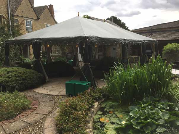 An attractive fully open boutique tent for serving drinks and canapes to 21st birthday party guests