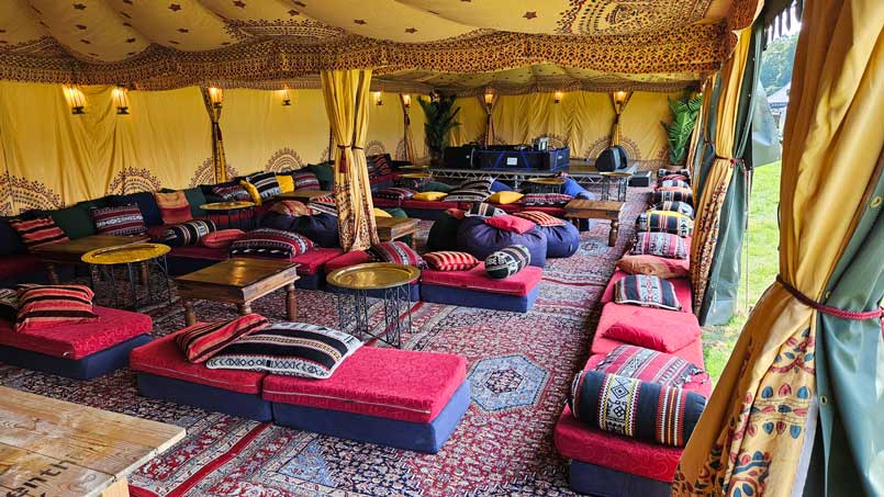 Chillout seating inside a bedouin tent for festival travel talks